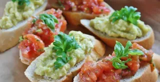 Recipe of Guacamole canapes shaped like a Christmas tree.